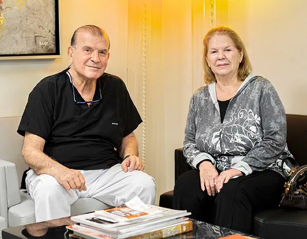Prof. Dr. Peker Sandallı with a patient in the clinic lounge